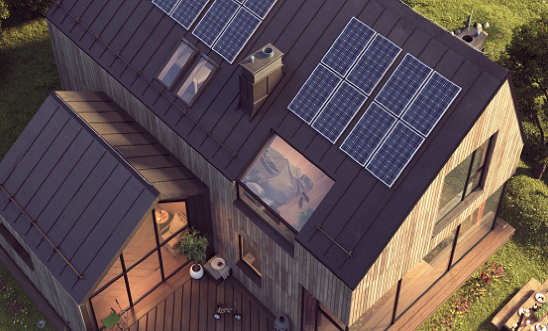 A house with solar panels on top.