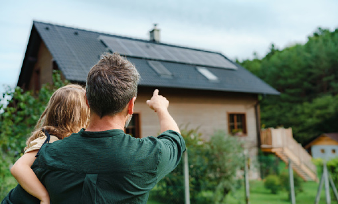 A house with solar panels on top.